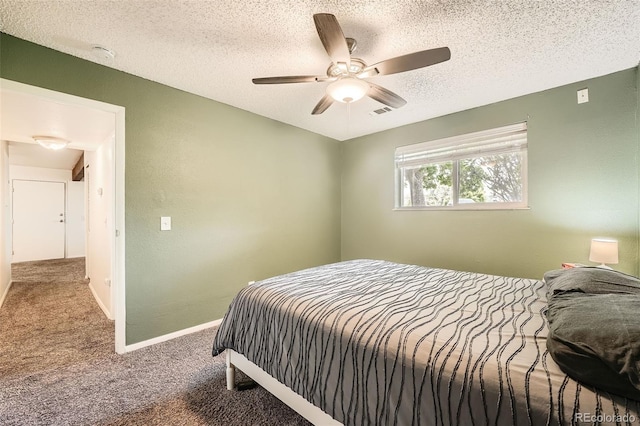 16259 W 10th Ave Unit K1, Golden, CO 80401 - bedroom with carpet flooring, a textured ceiling, and a ceiling fan