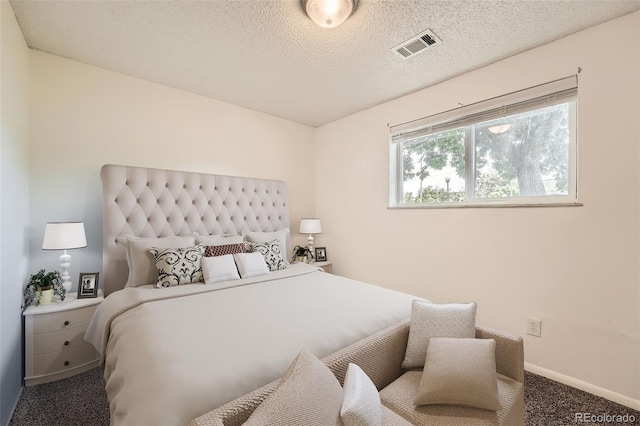 16259 W 10th Ave Unit K1, Golden, CO 80401 - carpeted bedroom with baseboards and a textured ceiling