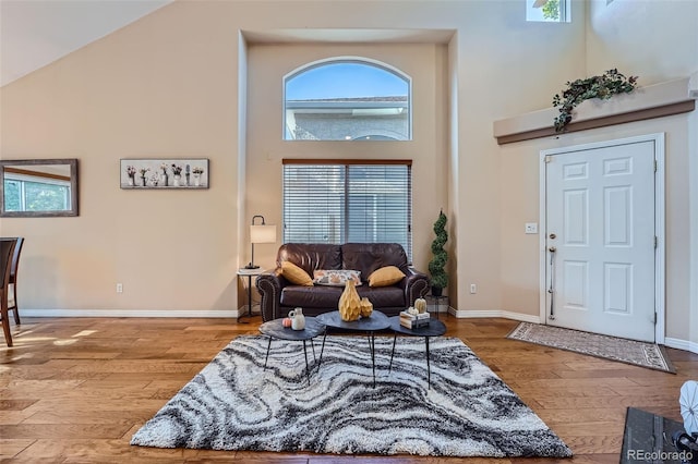 2417 S Racine Way, Aurora, CO 80014 - living area featuring a high ceiling and wood finished floors