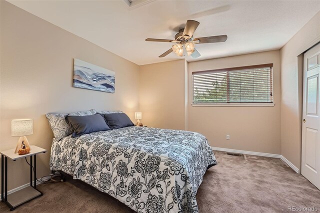 2417 S Racine Way, Aurora, CO 80014 - carpeted bedroom with multiple windows and ceiling fan