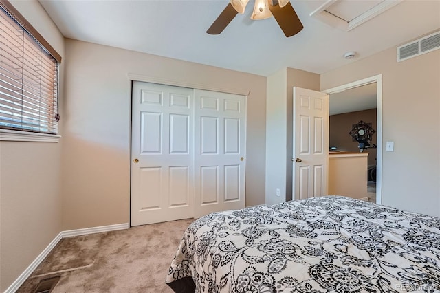 2417 S Racine Way, Aurora, CO 80014 - bedroom featuring light carpet, a closet, and a ceiling fan