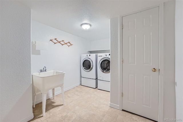 2417 S Racine Way, Aurora, CO 80014 - washroom featuring washing machine and dryer and baseboards