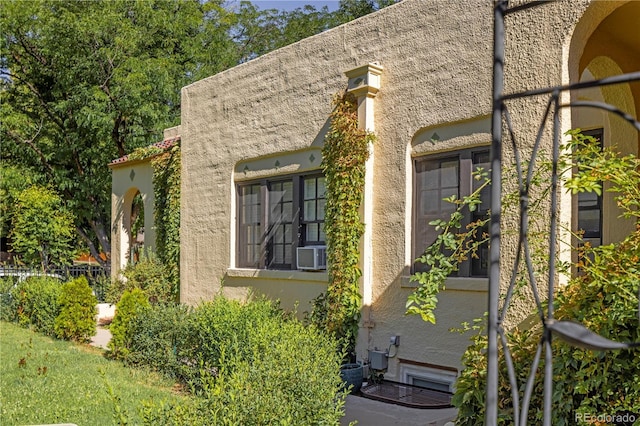 view of side of home with cooling unit