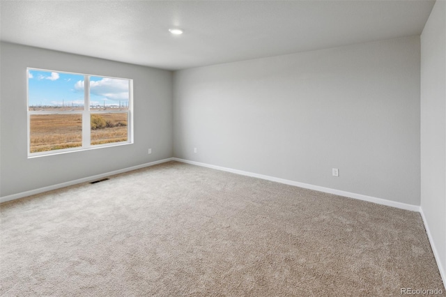 view of carpeted spare room