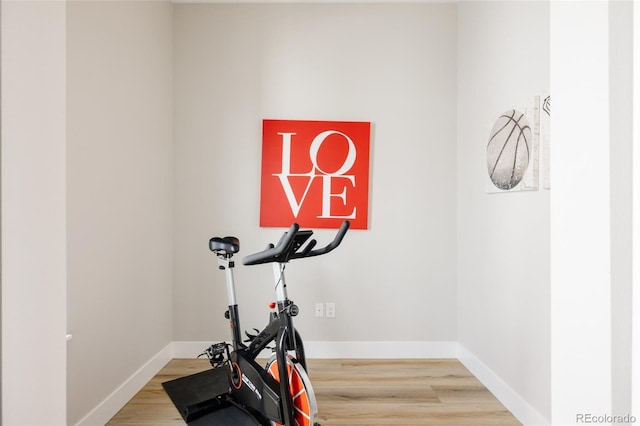 8280 E 36th Ave Unit 26, Denver, CO 80238 - workout room featuring wood finished floors and baseboards