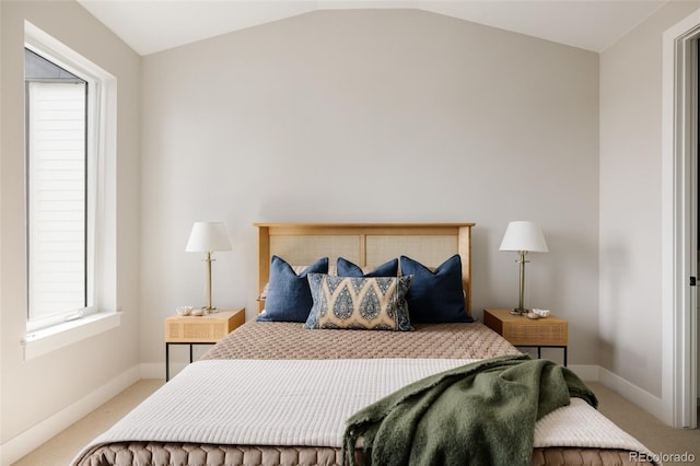 8280 E 36th Ave Unit 26, Denver, CO 80238 - carpeted bedroom featuring vaulted ceiling, multiple windows, and baseboards