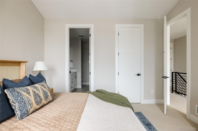 8280 E 36th Ave Unit 26, Denver, CO 80238 - bedroom featuring baseboards, carpet floors, and ensuite bathroom