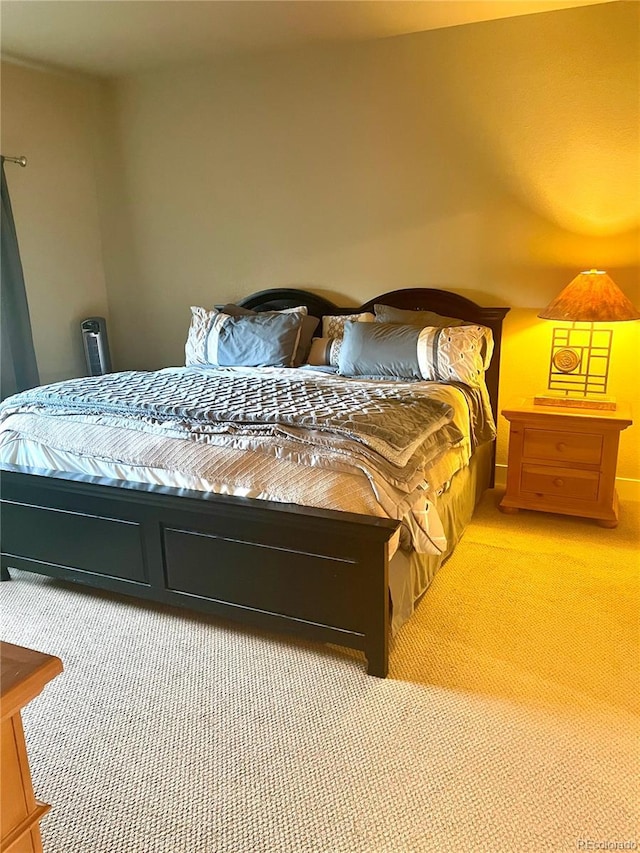 bedroom with light colored carpet
