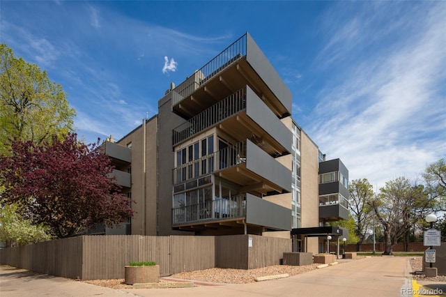 675 S University Blvd Unit 106, Denver, CO 80209 - view of apartment building / complex featuring fence