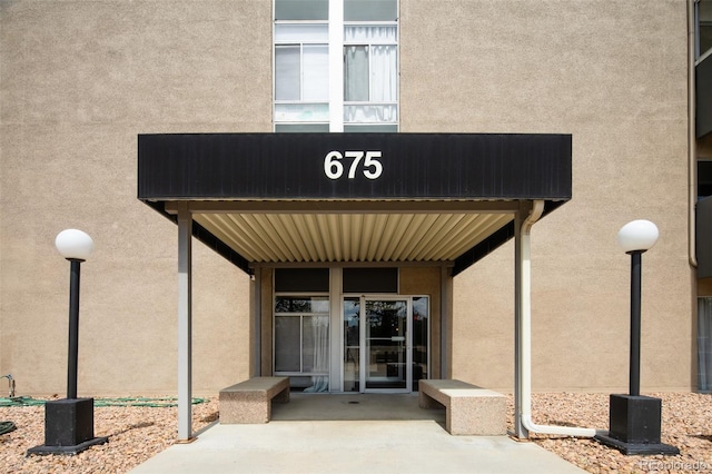 675 S University Blvd Unit 106, Denver, CO 80209 - property entrance with stucco siding and a patio