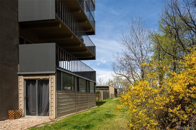675 S University Blvd Unit 106, Denver, CO 80209 - view of side of home with a yard and stucco siding