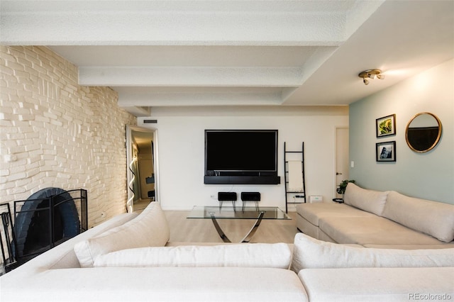 675 S University Blvd Unit 106, Denver, CO 80209 - living room featuring beam ceiling, a fireplace, and wood finished floors