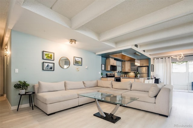 675 S University Blvd Unit 106, Denver, CO 80209 - living room with beam ceiling, light wood-style floors, and a chandelier