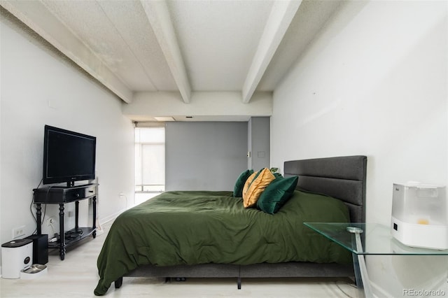 675 S University Blvd Unit 106, Denver, CO 80209 - bedroom with beamed ceiling and wood finished floors