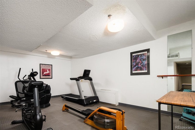 675 S University Blvd Unit 106, Denver, CO 80209 - exercise area featuring baseboards and a textured ceiling