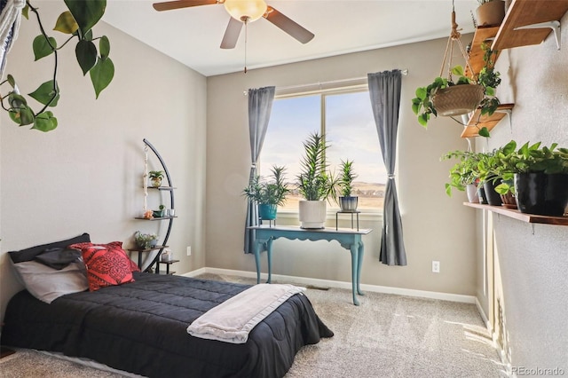 bedroom featuring light carpet, ceiling fan, and baseboards