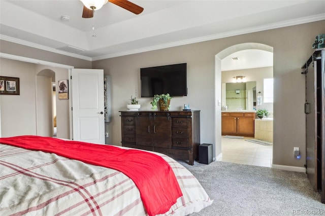 bedroom with arched walkways, a raised ceiling, light carpet, and crown molding