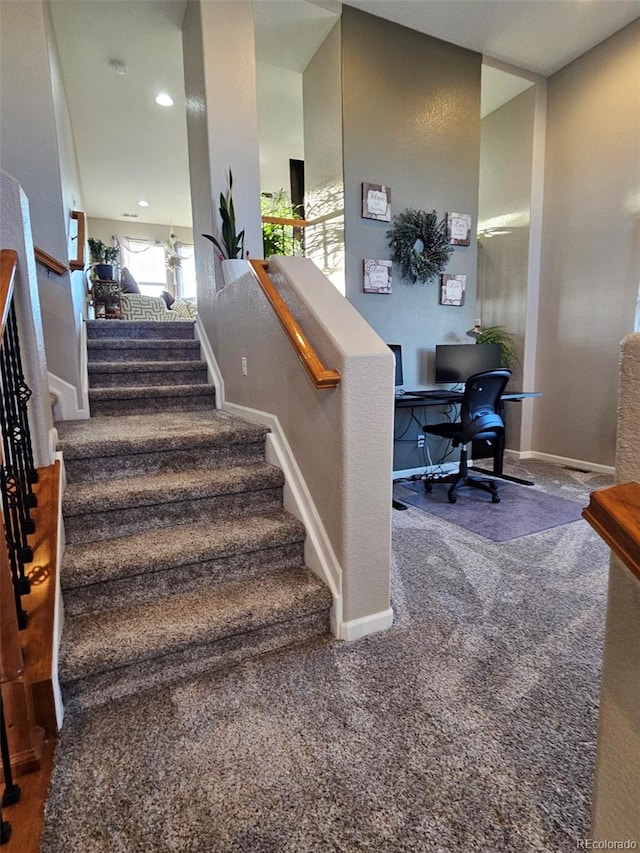 stairs with carpet, baseboards, and recessed lighting