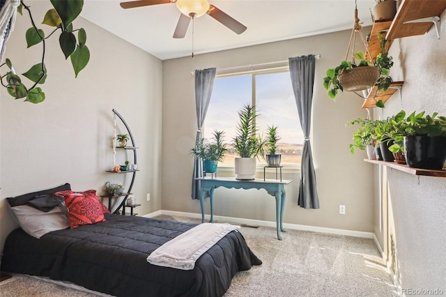 bedroom featuring baseboards, a ceiling fan, and carpet floors