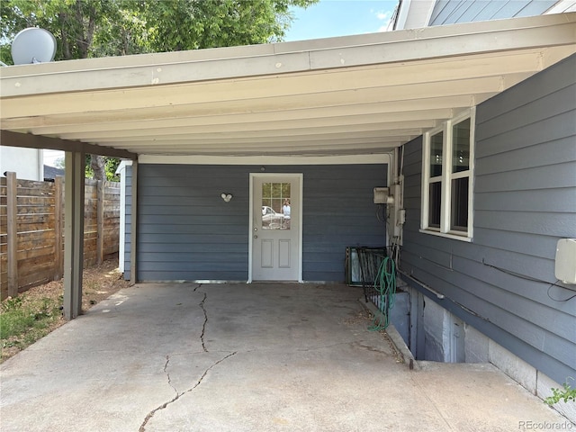 1337 Valentia St, Denver, CO 80220 - view of exterior entry with an attached carport
