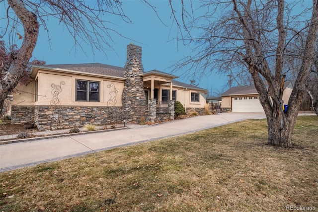 view of front of house with a garage and a front yard