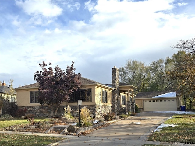 view of front of property featuring an outbuilding and a garage