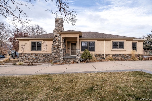 prairie-style house with a front lawn