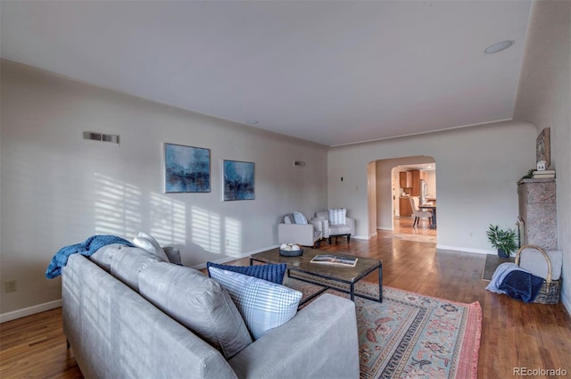 living room with dark wood-type flooring