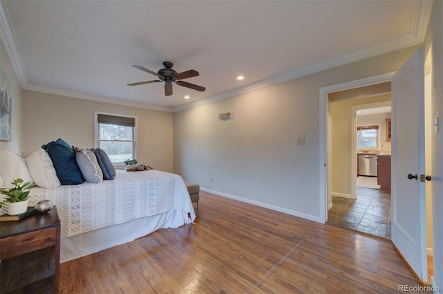 bedroom featuring ceiling fan, ornamental molding, and wood-type flooring