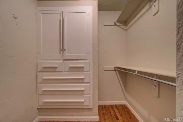 walk in closet featuring hardwood / wood-style floors