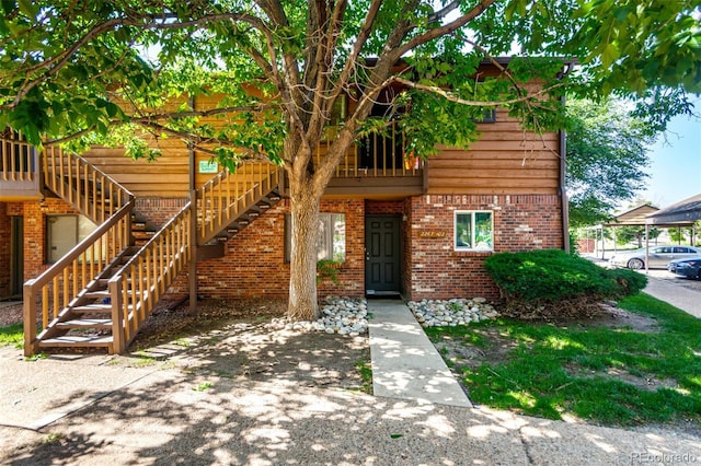 2267 S Buckley Rd Unit 202, Aurora, CO 80013 - view of front of house featuring brick siding and stairs