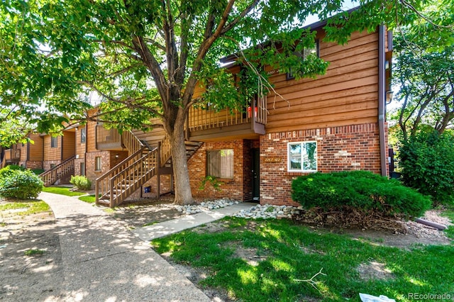 2267 S Buckley Rd Unit 202, Aurora, CO 80013 - view of front of home with brick siding and stairway