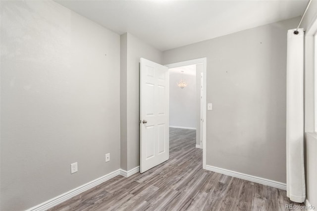 2267 S Buckley Rd Unit 202, Aurora, CO 80013 - spare room featuring wood finished floors and baseboards