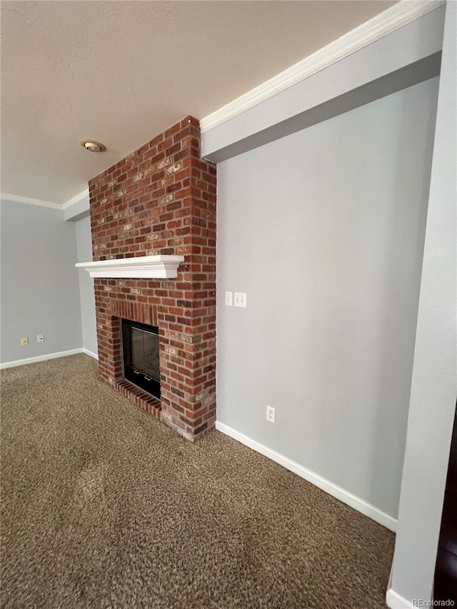 unfurnished living room with carpet, a fireplace, and crown molding