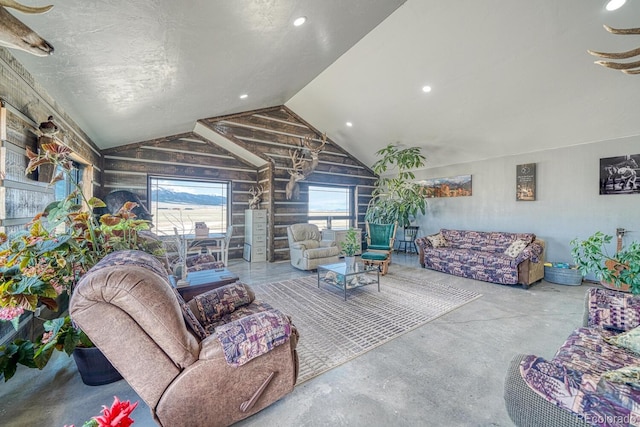 living room with recessed lighting, concrete floors, lofted ceiling, and rustic walls
