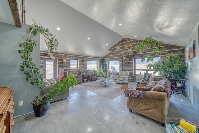 living area featuring a healthy amount of sunlight and lofted ceiling