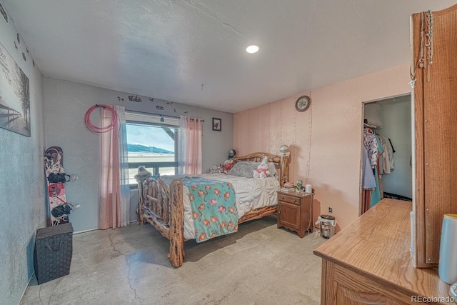 bedroom featuring concrete floors