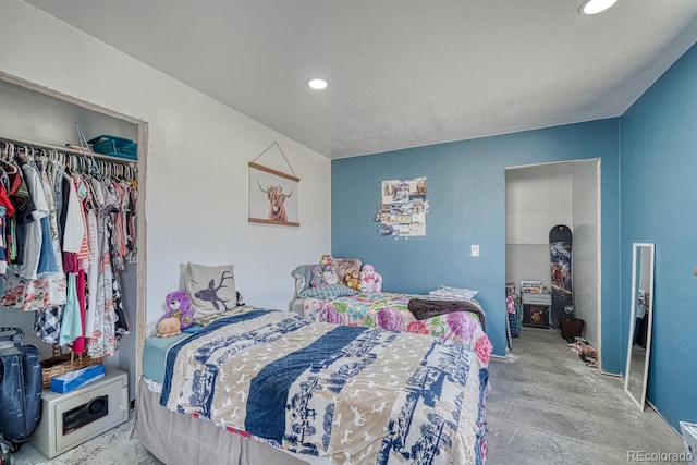 bedroom with a closet and recessed lighting