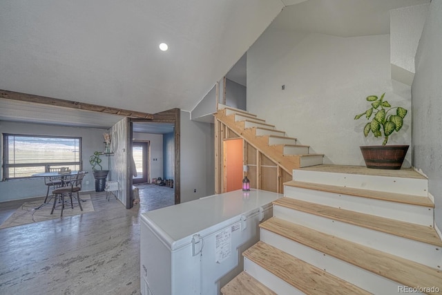 stairs with wood finished floors