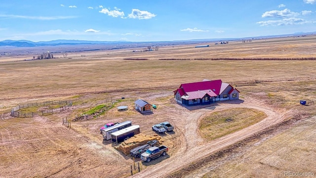 birds eye view of property with a rural view