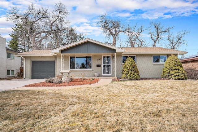 ranch-style house with a front yard, an attached garage, brick siding, and driveway