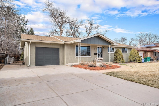 ranch-style home featuring brick siding, a shingled roof, fence, concrete driveway, and a garage