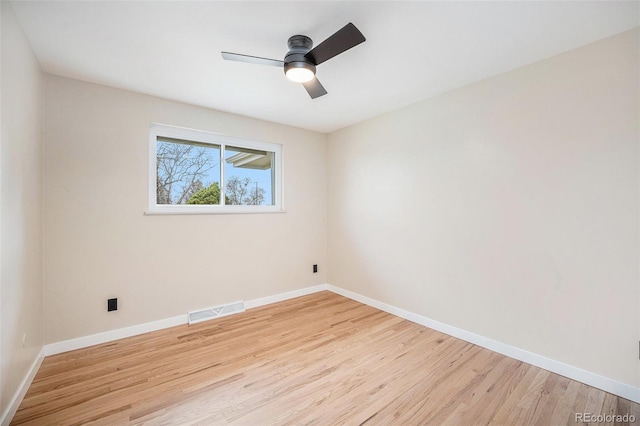 unfurnished room with visible vents, baseboards, and light wood finished floors