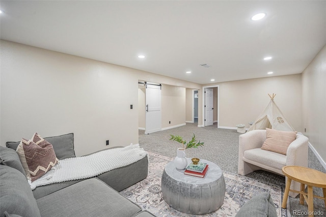 carpeted living area with recessed lighting, visible vents, and baseboards