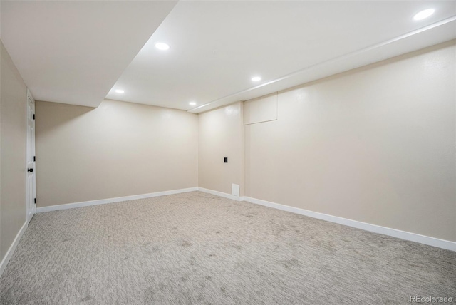 finished below grade area featuring recessed lighting, baseboards, and carpet floors