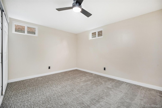 unfurnished room with carpet flooring, baseboards, and ceiling fan