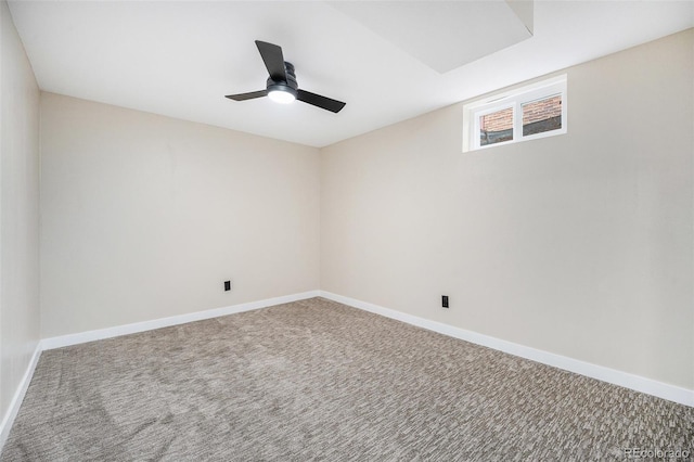 spare room featuring a ceiling fan, baseboards, and carpet floors