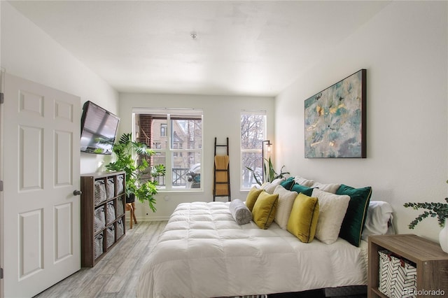 bedroom featuring light wood-type flooring