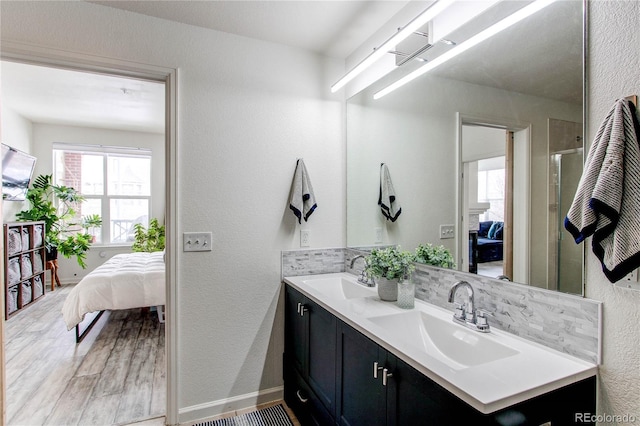 bathroom featuring vanity and hardwood / wood-style floors