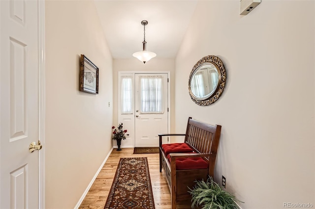 9925 W Progress Pl, Littleton, CO 80123 - entryway with light wood-style floors, vaulted ceiling, and baseboards